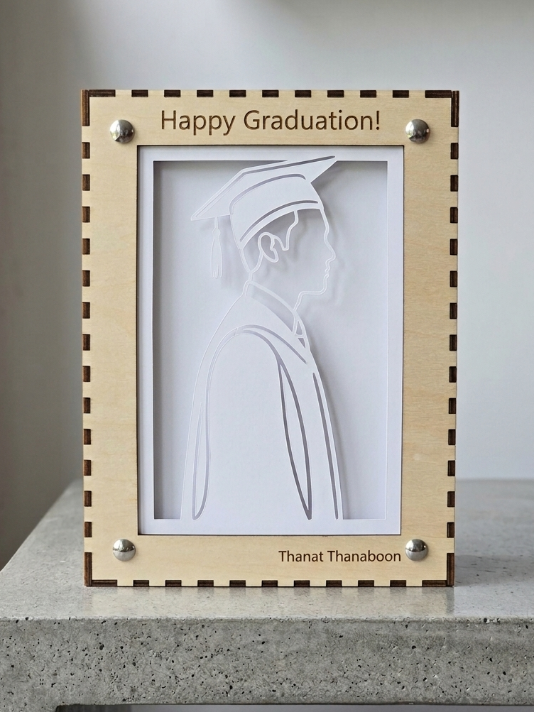 Laser-cut wooden graduation portrait with Happy Graduation engraving